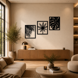 3-delige zwarte houten planten wanddecoratie boven dressoir in warme woonkamer